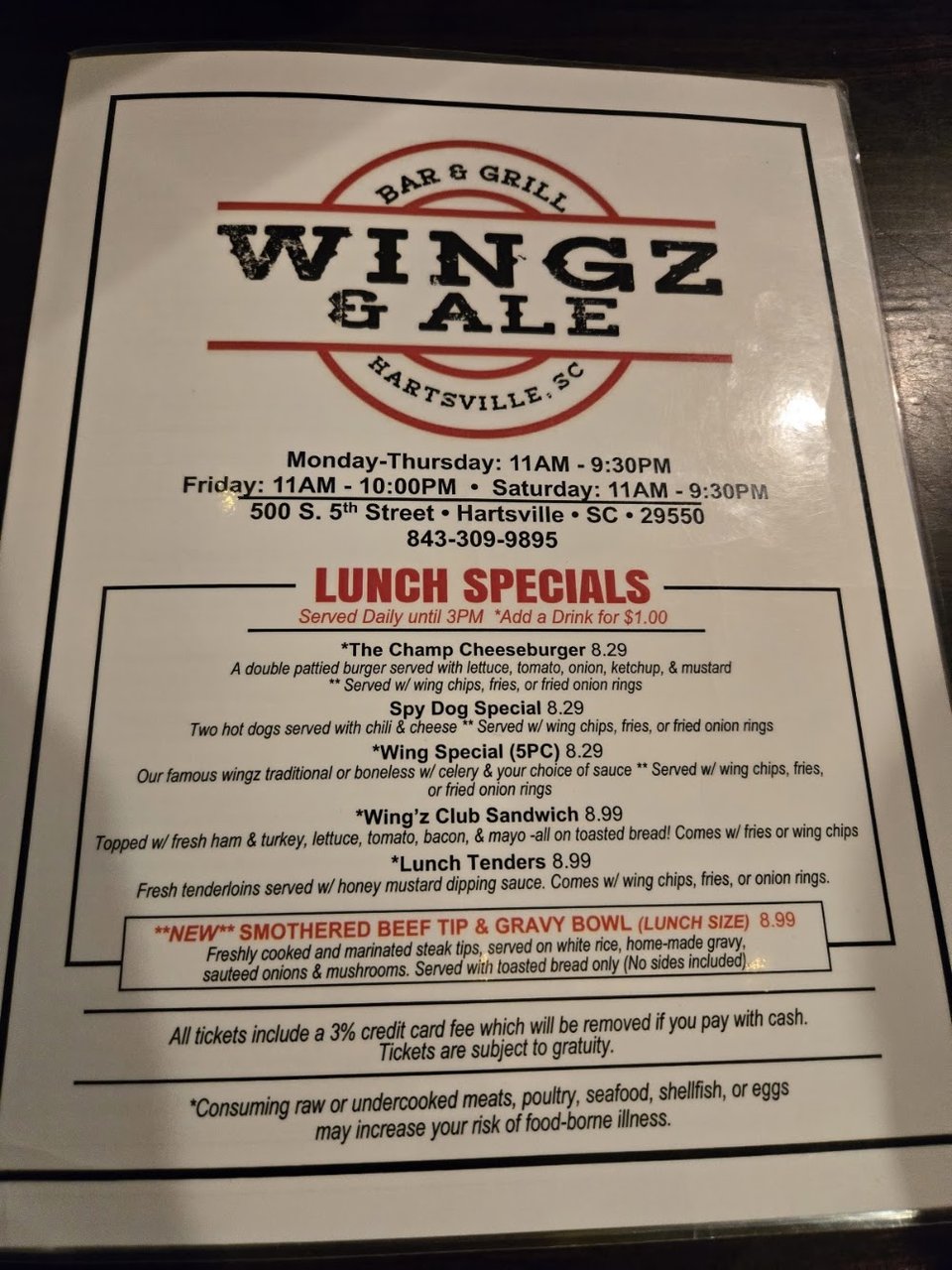 Menu board showing lunch specials and sides.